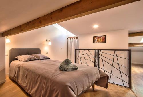a bedroom with a large bed in a room at Duplex 6 Pers - Panoramic Sea View - Old City - 2 mn Beach in Menton