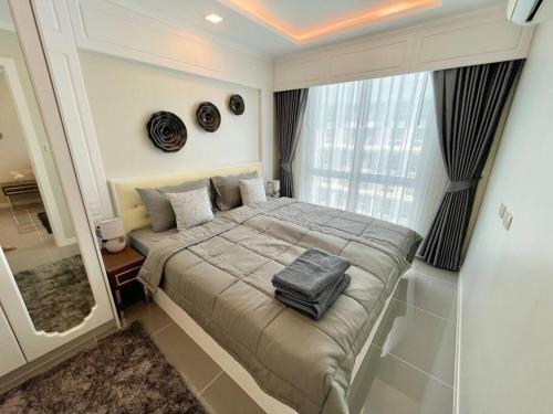 Kama o mga kama sa kuwarto sa ELEGANT 1 Bedroom in Orient Resort & Spa