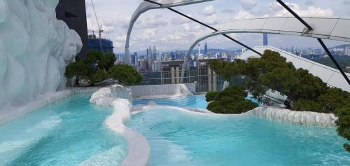 a water slide on the top of a building at Arte Mont Kiara by iLuxHome in Kuala Lumpur