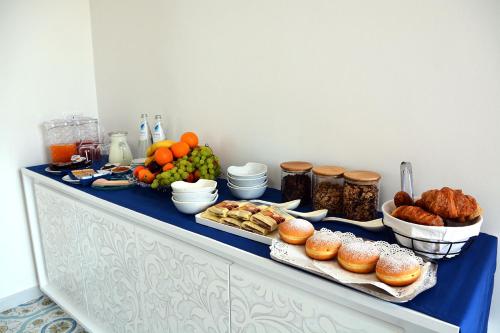 a buffet with different types of food on a table at Andrea Room&Breakfast in Capaccio-Paestum