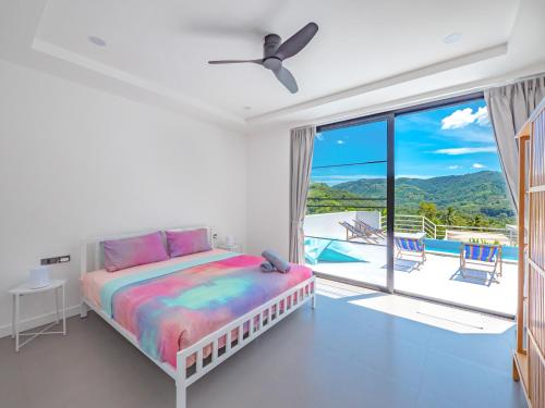 a bedroom with a bed and a balcony with a view at M&C Villa 2 bedrooms Lamai Amazing view in Lamai