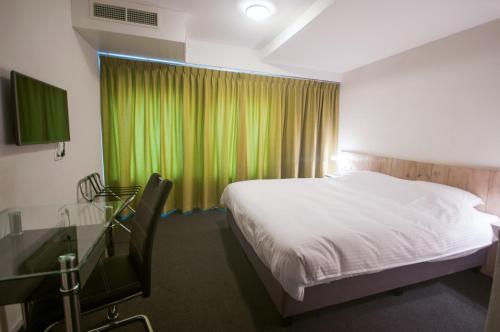 Hotel Taurusにあるテレビまたはエンターテインメントセンター