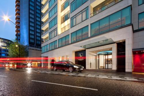 a car parked in front of a building at COMO Metropolitan London in London