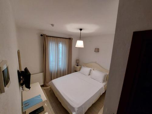 Letto o letti in una camera di Ferahi Evler Ayvalık