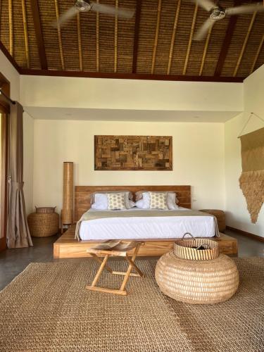 Postel nebo postele na pokoji v ubytování La Reserva Villas Bali