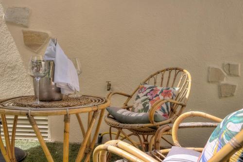 a patio with chairs and a table with a blender at Maison Lamartine - Nice in Nice