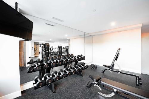 a gym with a lot of equipment in a room at The Sutton Place Hotel Halifax in Halifax