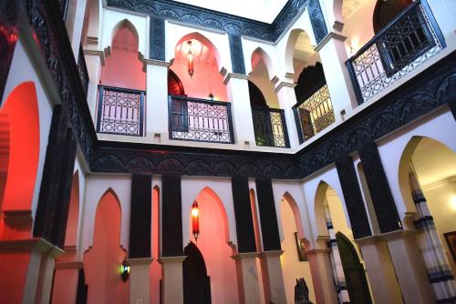 a view of the inside of a building with arches at Ryad Laârouss in Marrakesh