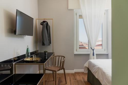 TV a/nebo společenská místnost v ubytování NUE SUITES