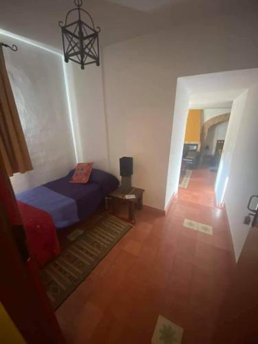 Postel nebo postele na pokoji v ubytování Hotel Rural La Posada de las Cigüeñas