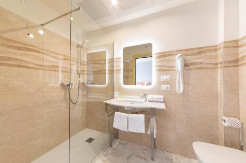 a bathroom with a sink and a shower at Torre Antica Venice Airport Hotel in Tessera
