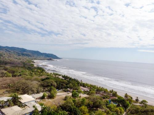 an aerial view of the beach and the ocean at Ventura Santa Teresa in Santa Teresa Beach
