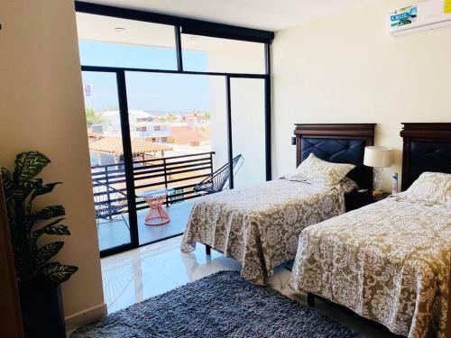 Postel nebo postele na pokoji v ubytování HERMOSO DEPARTAMENTO A UNOS PASOS DE LA PLAYA