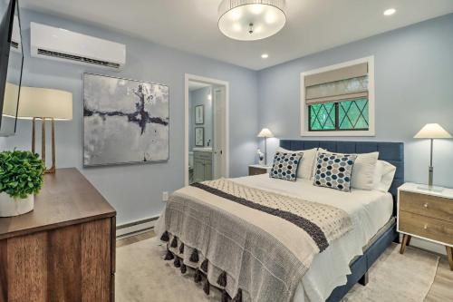 a bedroom with a bed and a desk and a window at Near Skiing and Hiking Gouldsboro Home with Hot Tub in Gouldsboro