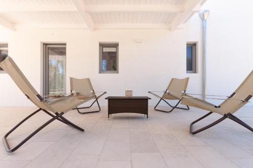 a room with two chairs and a table at Le Dimore Di Speziale in Fasano