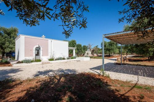 a building with a pavilion in front of it at Le Dimore Di Speziale in Fasano