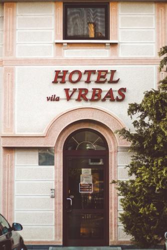 a hotel viridis sign on the front of a building at Hotel Vila Vrbas in Banja Luka