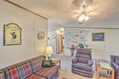 a living room with a couch and a chair at Bright Steinhatchee Home Proximity to Ocean! in Steinhatchee