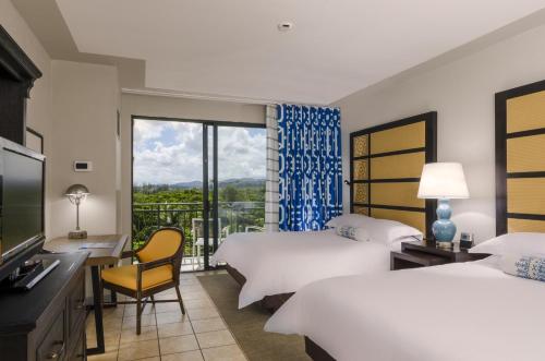 Postel nebo postele na pokoji v ubytování Wyndham Grand Rio Mar Rainforest Beach and Golf Resort