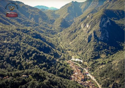 a hot air balloon flying over a mountain valley at Spada Reale in Valdieri