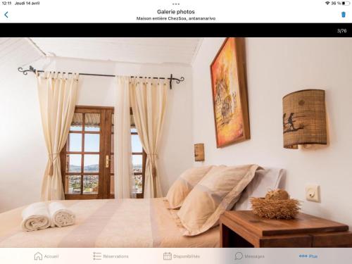 a bedroom with a bed and a window at Maison entière ChezSoa, antananarivo in Andoharanofotsy
