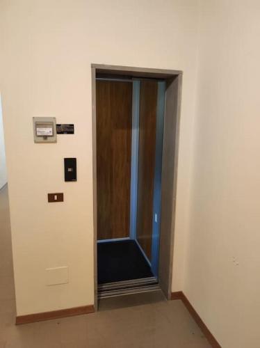 a hallway with a glass door in a building at Appartamento Belvedere Abetone in Abetone