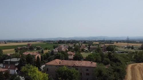 an aerial view of a small village with houses and trees at Sala dell Estate Guest House in Secchia