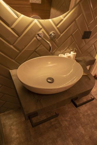 a bathroom sink sitting on a counter in a bathroom at Da Placida Al Mare - Luxury B&B Soverato in Soverato Marina