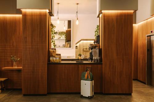 a room with wooden partitions and a counter with a suitcase at Sonder Henri on 24 in New York