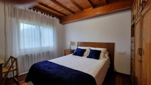 מיטה או מיטות בחדר ב-Finca Bouzas