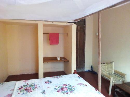 Ένα ή περισσότερα κρεβάτια σε δωμάτιο στο Mgeni Homestay