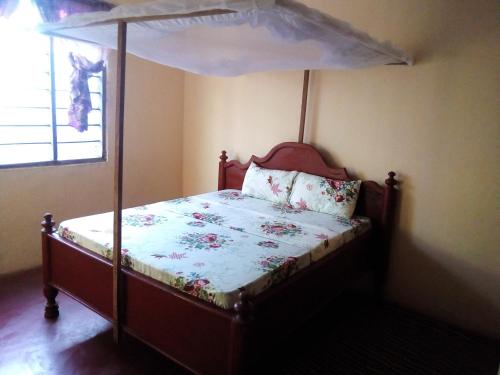 Ένα ή περισσότερα κρεβάτια σε δωμάτιο στο Mgeni Homestay