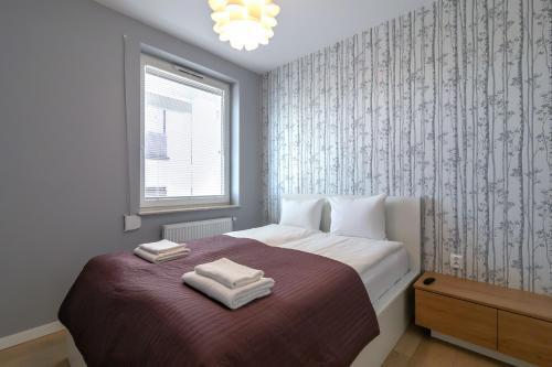 Posteľ alebo postele v izbe v ubytovaní Apartament Muszelka Jantar TriApart