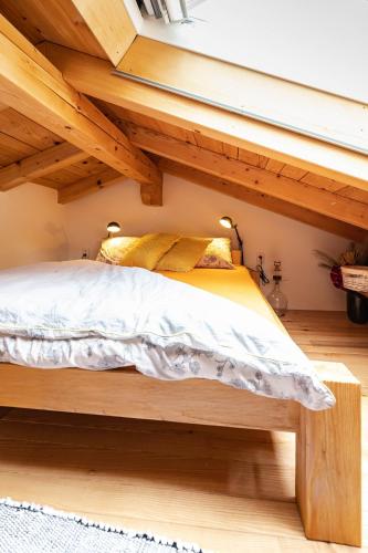 a bed in a small room under a loft at Rašpor in Rašpor