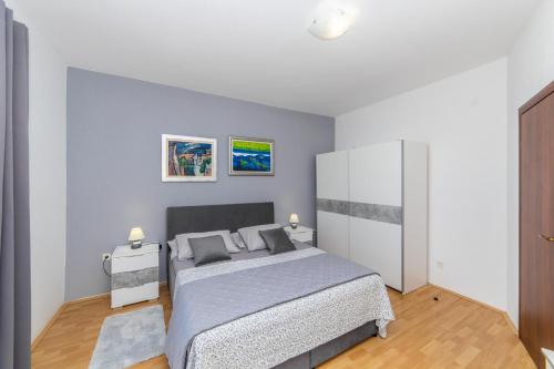 Postel nebo postele na pokoji v ubytování APARTMANI LILE