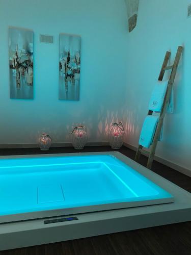 a swimming pool in a room with a ladder at Suite87 in Mesagne