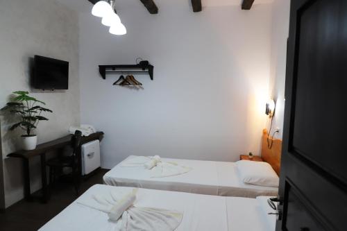 Llit o llits en una habitació de Vila Darla