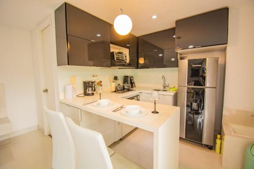 Kuchyň nebo kuchyňský kout v ubytování Loft moderno en El Poblado con vista y parqueadero Mio Lofts