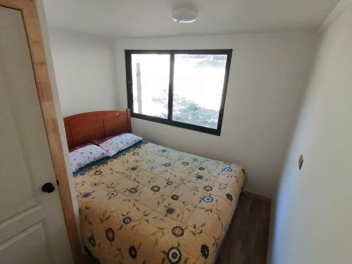 Postel nebo postele na pokoji v ubytování Cabaña Rústica en Pichilemu