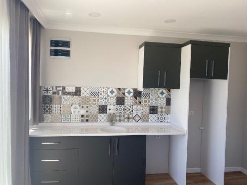A kitchen or kitchenette at VENÜS PARK APART SUİTES