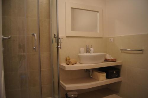 a bathroom with a sink and a shower at Home in Orvieto - Corso Cavour in Orvieto