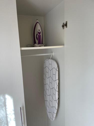 a towel hanging on a wall in a bathroom at Apartamento vacacional in El Pont de Suert