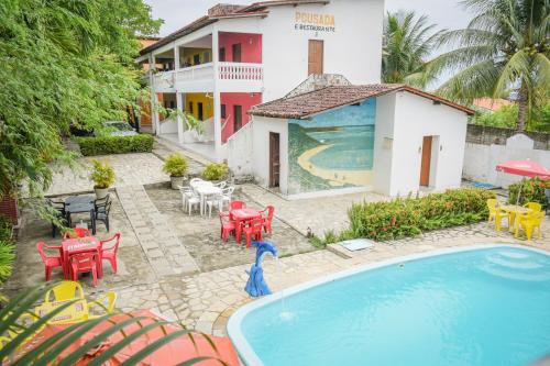 an aerial view of a resort with a swimming pool at Passarela do Caranguejo PB in Conde