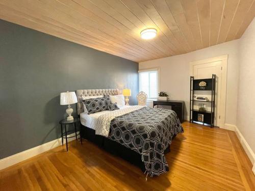 a bedroom with a large bed and a wooden floor at Golden Gate Park Sweet Home- 3 Bedrooms in San Francisco