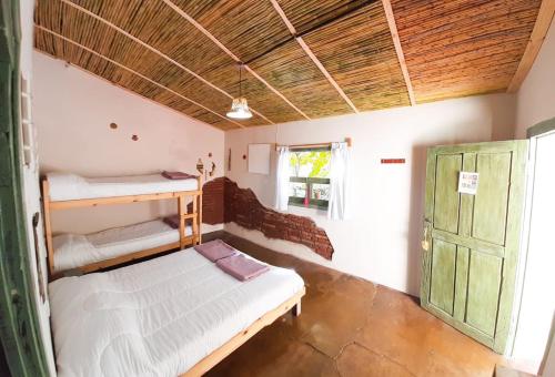 Двухъярусная кровать или двухъярусные кровати в номере Cielito Lindo