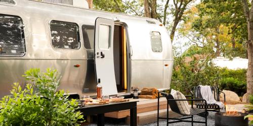 an rv with a table in front of it at AutoCamp Cape Cod in Falmouth