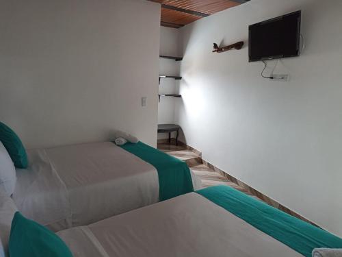 Ένα ή περισσότερα κρεβάτια σε δωμάτιο στο Hotel SAMAI