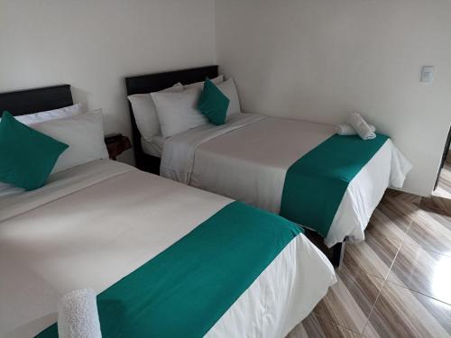 Ein Bett oder Betten in einem Zimmer der Unterkunft Hotel SAMAI