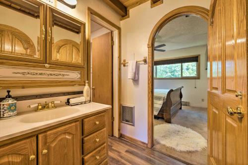 a bathroom with a sink and a mirror at Brian Head Condo with Deck and View - Walk to Ski Lift in Brian Head