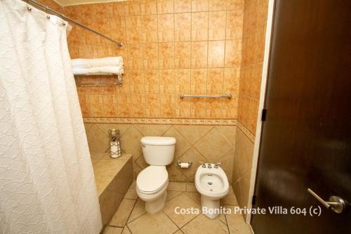 a small bathroom with a toilet and a bidet at Costa Bonita Private Villa 604 in Culebra